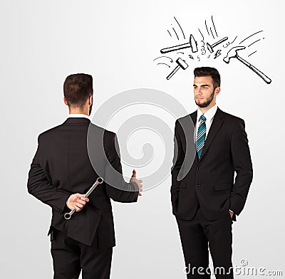 Businessman hiding a weapon Stock Photo