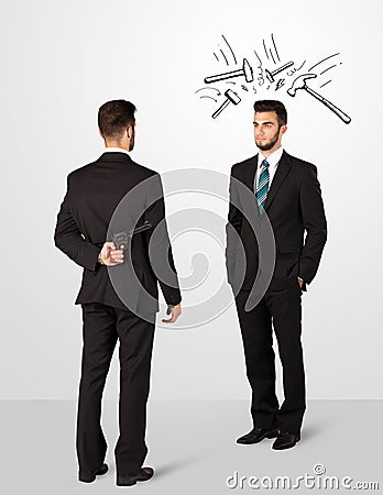 Businessman hiding a weapon Stock Photo