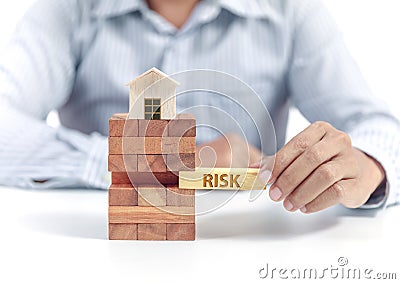 Businessman hold wooden bloc with wording risk Stock Photo