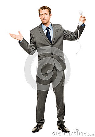 Businessman holding analogue phone Stock Photo