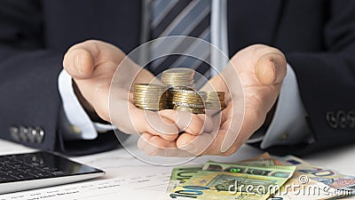 businessman holding bunch coins 2. High quality beautiful photo concept Stock Photo