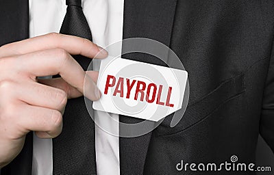 Businessman holding a card with text Payroll Stock Photo