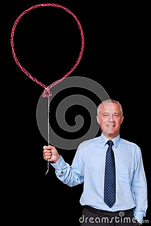 Businessman holding a chalk balloon Stock Photo