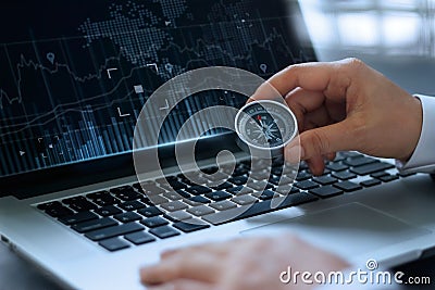 Businessman holding compass with searching screen laptop Stock Photo