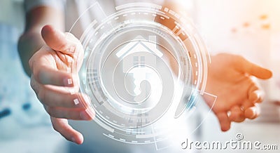 Businessman holding 3D rendering icon house in his hand Stock Photo