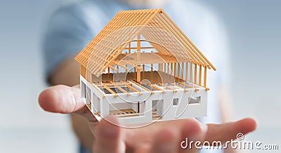 Businessman holding 3D rendering unfinished plan house in his ha Stock Photo