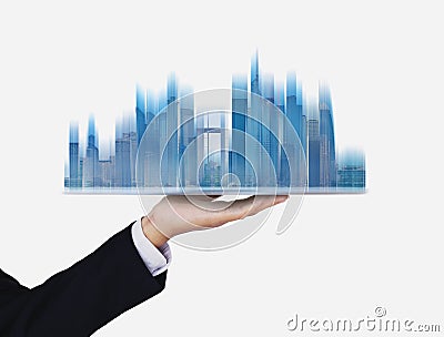 Businessman holding futuristic smart buildings hologram, on white background Stock Photo