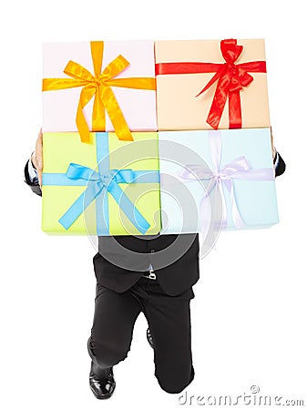 Businessman holding gifts and kneel down . Stock Photo