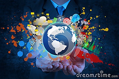 Businessman holding a glowing earth globe Stock Photo