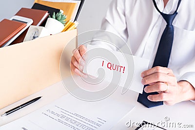Businessman holding with I quit words card letter, resign employee Change of job concept Stock Photo