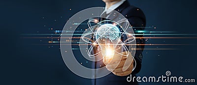 Businessman holding light bulb and brain inside, Idea and imagination, Creative and inspiration, Science innovation with network Stock Photo