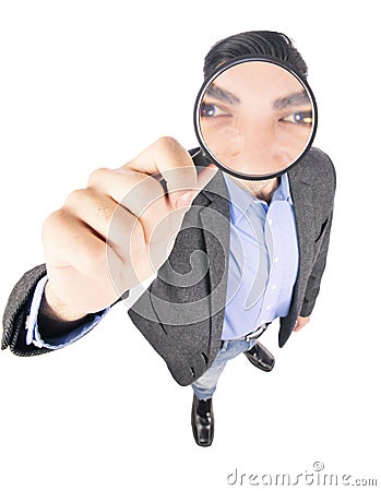 Businessman holding magnify glass Stock Photo