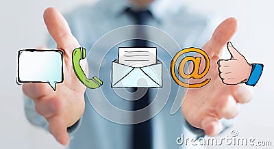 Businessman holding manuscript contact icon in his hand Stock Photo