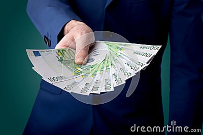 Businessman holding money Stock Photo