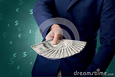 Businessman holding money Stock Photo