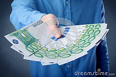 Businessman holding money Stock Photo