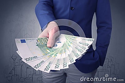 Businessman holding money Stock Photo