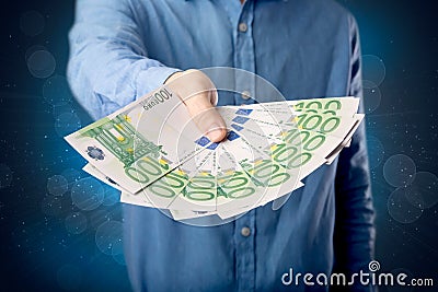 Businessman holding money Stock Photo