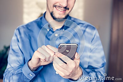 Businessman holding the new Apple iPhone 6s retina Editorial Stock Photo