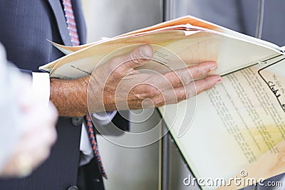 Businessman holding papers Stock Photo