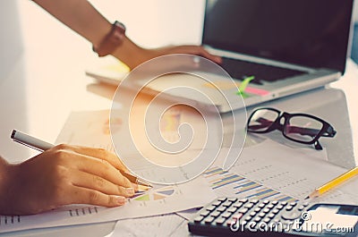 Businessman holding paperwork on the table Stock Photo