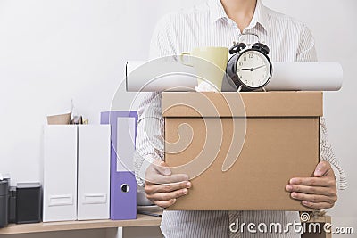Businessman holding personal items box ready moving leaving Stock Photo