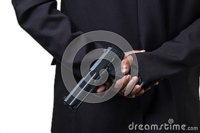 Businessman Holding a Pistol Gun. Concept Picture of Assassin or Smart Bodyguard Stock Photo
