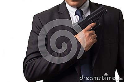 Businessman Holding a Pistol Gun. Concept Picture of Assassin or Smart Bodyguard Stock Photo
