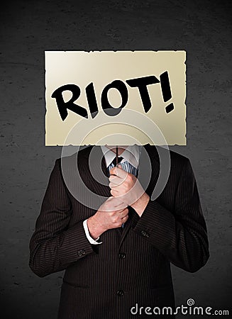 Businessman holding a protest sign Stock Photo