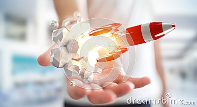 Businessman holding red rocket in his hand 3D rendering Stock Photo