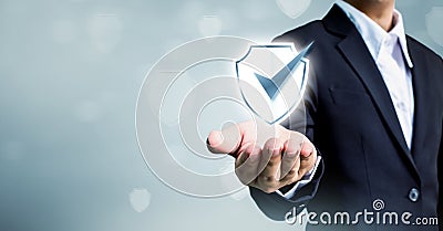 Businessman holding shield protect icon, Concept cyber security Stock Photo