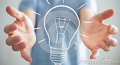 Businessman holding a sketch lightbulb Stock Photo