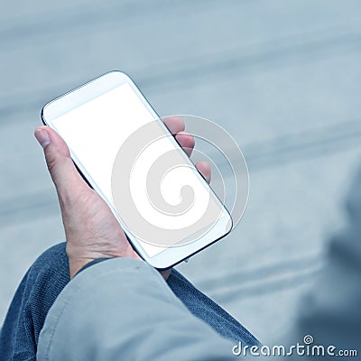 Businessman holding smart phone with empty screen Stock Photo