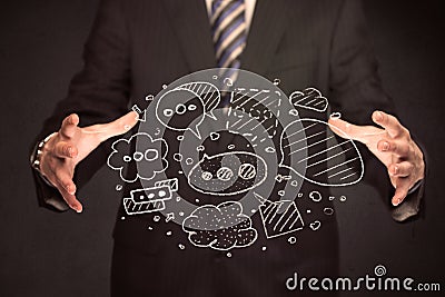 Businessman holding speech bubbles Stock Photo