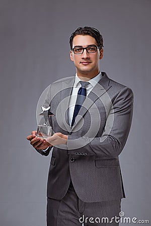 The businessman holding star award in business concept Stock Photo