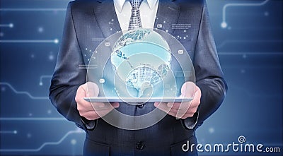 Businessman holding tablet which is showing hologram of the Earth Stock Photo