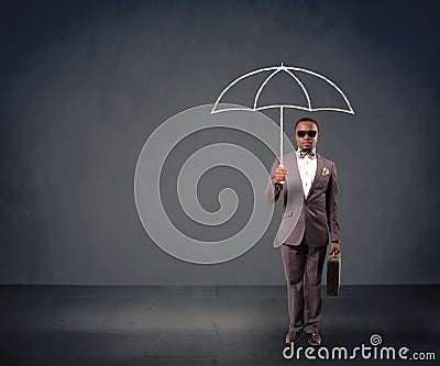 Businessman holding an umbrella. Stock Photo