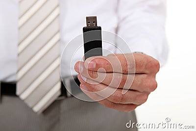 Businessman holding USB stick Stock Photo