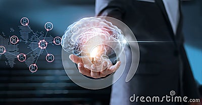 Businessman holding virtual brain with global networking Stock Photo