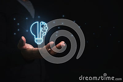 Businessman holding virtual light bulb and half brain on blue bokeh background smart thinking concept and innovative ideas Stock Photo