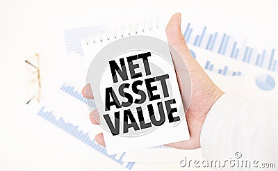 Businessman holding a white notepad with text NET ASSET VALUE, business concept Stock Photo
