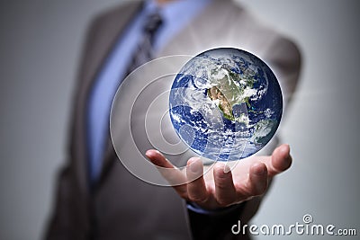 Businessman holding the world in his hands Stock Photo