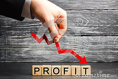 A businessman holds a red arrow to down and the inscription `profit`. Unsuccessful business and poverty. Profit decline. Loss of i Stock Photo