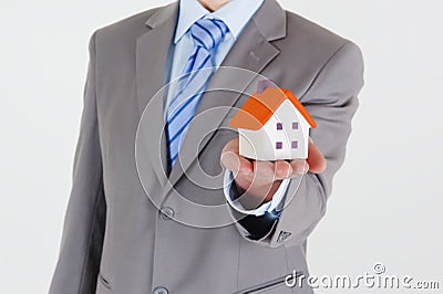 Businessman with a house Stock Photo