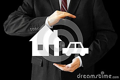 Businessman - house and car insurance concept Stock Photo