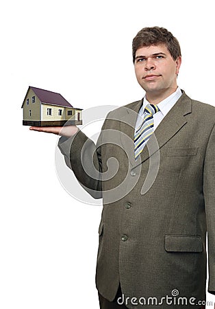 Businessman with house in hand Stock Photo