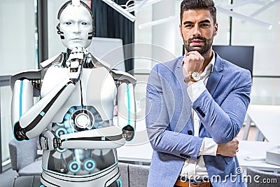 Businessman and Humanoid Robot Stock Photo