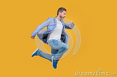 Businessman hurry being late. Shocked late businessman checking time in midair. late businessman Stock Photo
