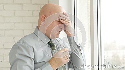 Businessman Image Suffering a Headache with a Glass with Water in Hand Stock Photo
