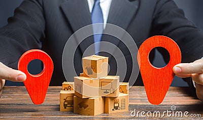 The businessman indicates the points of the route of supply and delivery of goods. Distribution. Trade logistics. Task of Stock Photo